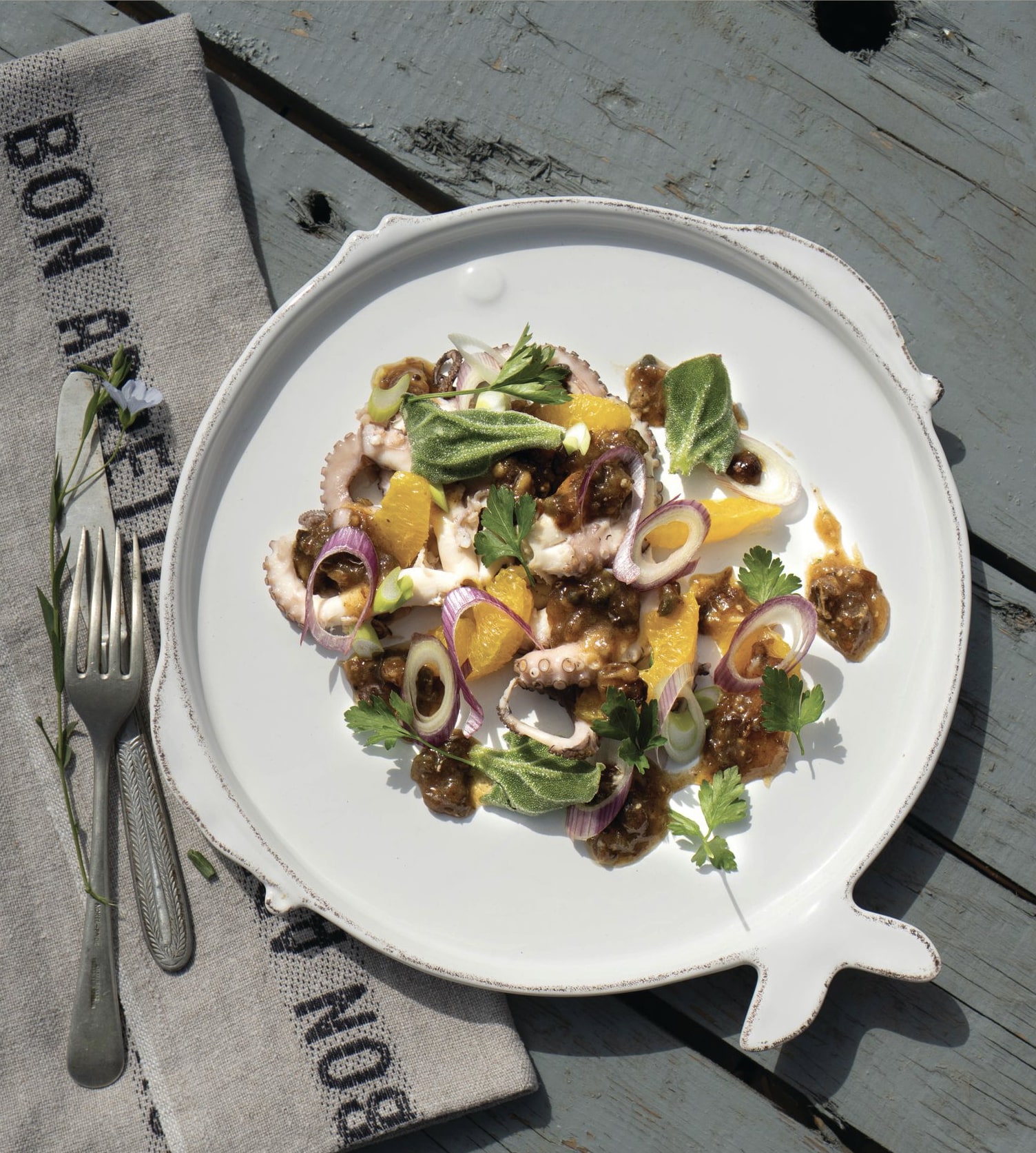Grilled octopus served with olive oil and lemon dressing